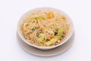A mouthwatering dish of stir-fried vermicelli noodles with vegetables and egg.